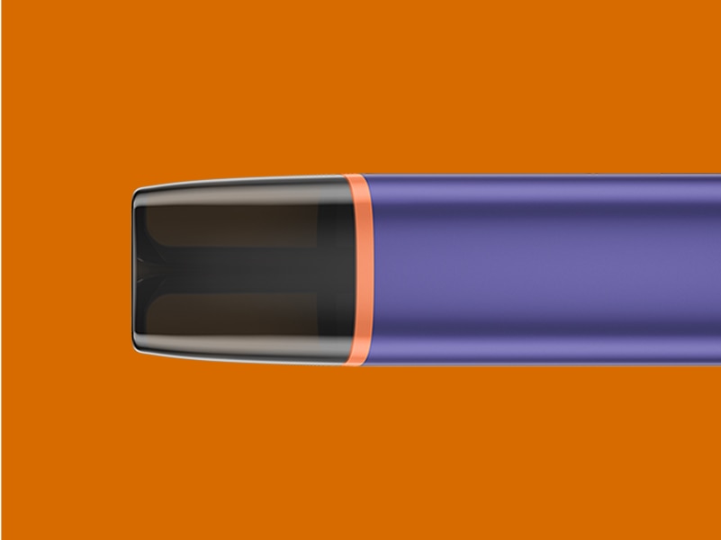 View of a VEEV ONE vape at a 90-degree angle with an orange background
