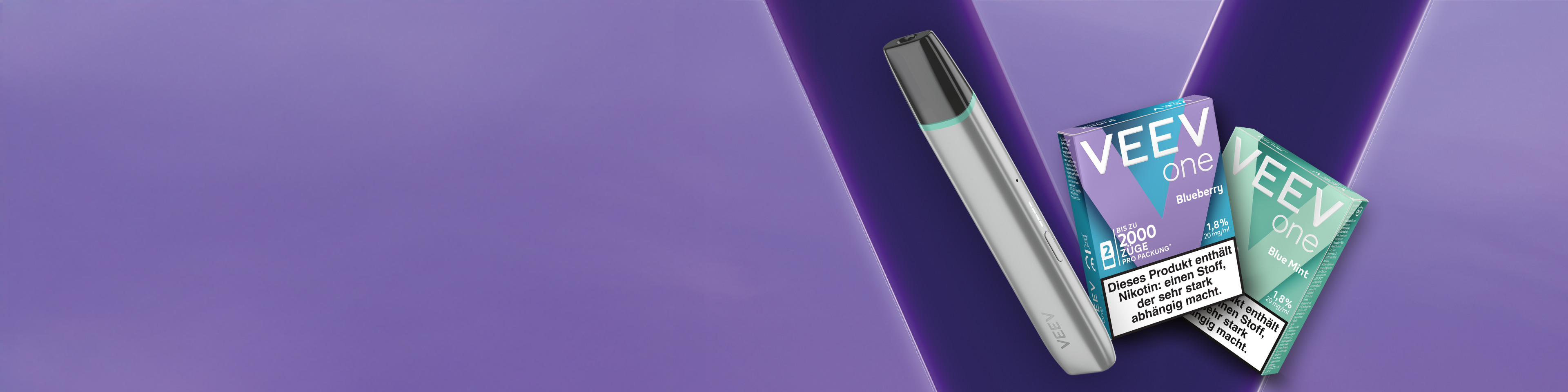 Vier neu VEEV ONE Extra Flavours vor einem explosiv Hintergrund.