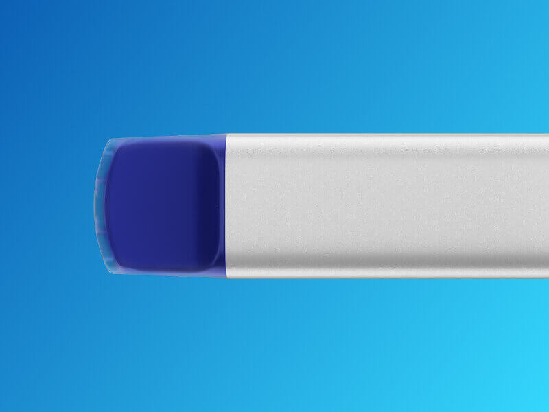 Close up of the VEEV NOW blue raspberry vape mouthpiece with patterned blue background