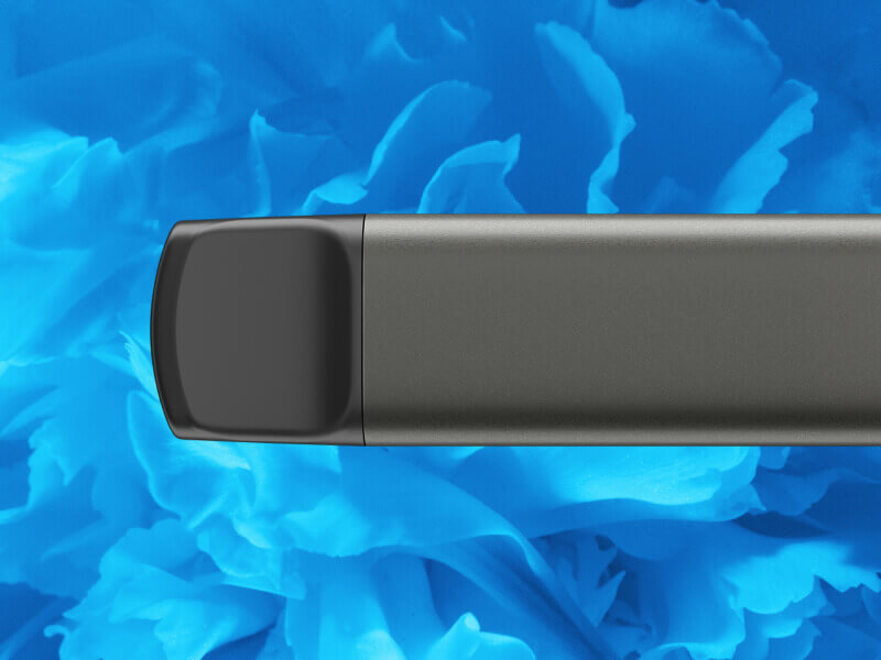 Gotowy do użycia jednorazowy e-papieros VEEV NOW na niebieskim tle